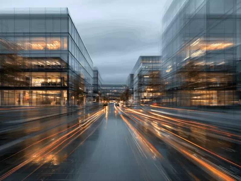 Salle de réunion lumineuse dans un business center en Suisse, avec vue sur les Alpes et une équipe en discussion autour de solutions d’intelligence artificielle